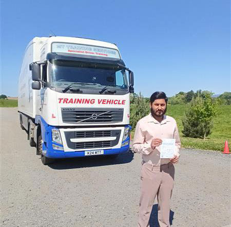 Usama celebrating his clean sheet CE 3b HGV test pass at MT Training Birmingham