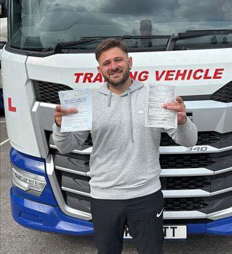 Dimitrije proudly holding his CE 3b pass certificate at MT Training Exeter after passing first time