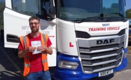 Henry from Burcombe Haulage holding his CE 3b pass certificate at MT Training Plymouth