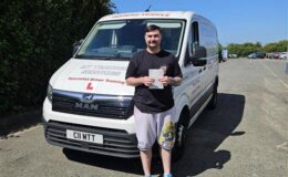 Sam holding his C1 3a pass certificate at MT Training’s Bristol Training Centre