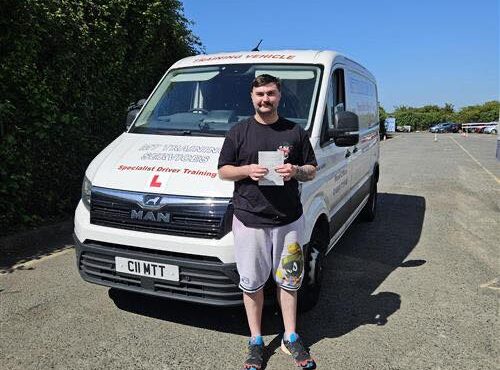 Sam holding his C1 3a pass certificate at MT Training’s Bristol Training Centre