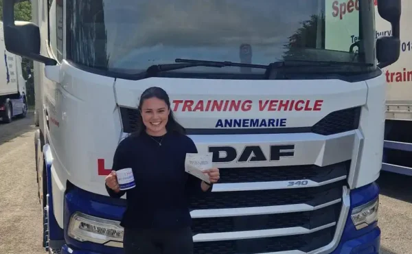 Annabel holding her CE 3b pass certificate at MT Training’s Tewkesbury centre after a successful HGV test